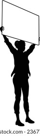 Protestor or demonstrator at a demonstration march, picket line or strike protest rally in silhouette. Holding up a banner or picket sign board placard.