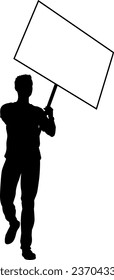 Protestor or demonstrator at a demonstration march, picket line or strike protest rally in silhouette. Holding up a banner or picket sign board placard.