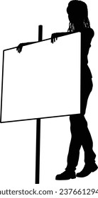 Protestor or demonstrator at a demonstration march, picket line or strike protest rally in silhouette. Holding up a banner or picket sign board placard.
