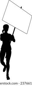 Protestor or demonstrator at a demonstration march, picket line or strike protest rally in silhouette. Holding up a banner or picket sign board placard.