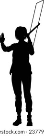 Protestor or demonstrator at a demonstration march, picket line or strike protest rally in silhouette. Holding up a banner or picket sign board placard.