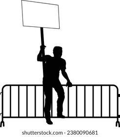 Protestor or demonstrator at a demonstration march, picket line or strike protest rally in silhouette. Holding up a banner or picket sign board placard.