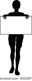 Protestor or demonstrator at a demonstration march, picket line or strike protest rally in silhouette. Holding up a banner or picket sign board placard.
