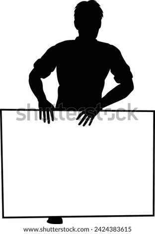 Protestor or demonstrator at a demonstration march, picket line or strike protest rally in silhouette. Holding up a banner or picket sign board placard.