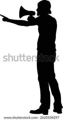 Protestor or demonstrator at a demonstration march, picket line or strike protest rally in silhouette. Using a megaphone, mega phone or bullhorn.
