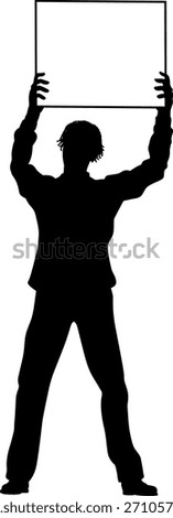 Protestor or demonstrator at a demonstration march, picket line or strike protest rally in silhouette. Holding up a banner or picket sign board placard.