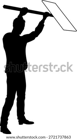 Protestor or demonstrator at a demonstration march, picket line or strike protest rally in silhouette. Holding up a banner or picket sign board placard.