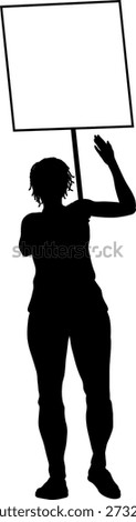 Protestor or demonstrator at a demonstration march, picket line or strike protest rally in silhouette. Holding up a banner or picket sign board placard.