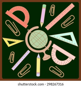protractor, ruler, globe and pencils on the background of the school board