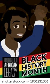 Proud dark skinned man wearing traditional African clothes and hand held high, promoting the African legacy and heritage during Black History Month.