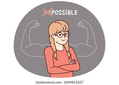 Proud little girl stands with arms crossed near inscription impossible is possible and muscular arms drawn on blackboard. Schoolgirl teenager successfully cope with challenge and gained new knowledge