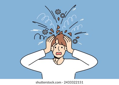 Psychological unbalanced man feels head explode due to excessive worries caused by stress. Overload of thoughts and mental pressure became reason for psychological breakdown or panic attack