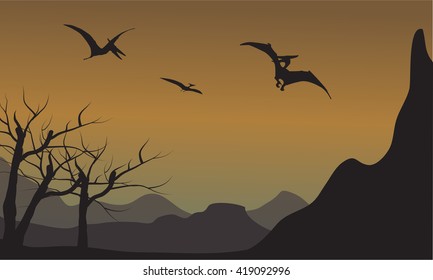 Pterodactyl silhouette in mountain at the afternoon