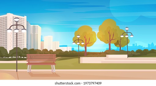 public park with wooden bench and streetlights cityscape background horizontal