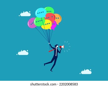 public relations. businessman floats a speech balloon and talks through a megaphone