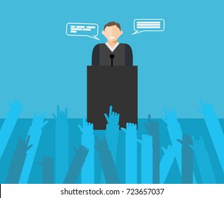 Public speaker giving a speech to a crowd of people.