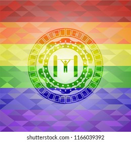 pull up icon inside emblem on mosaic background with the colors of the LGBT flag