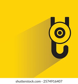 pulley and crane hook icon with shadow on yellow background