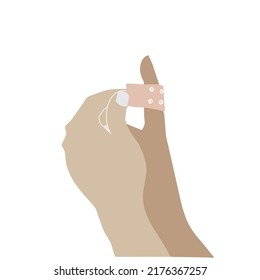Pulling off the adhesive tape from the finger