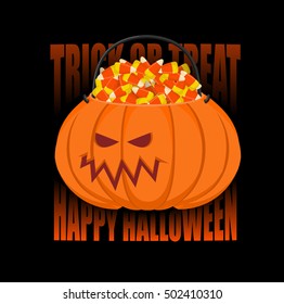 Pumpkin basket for Halloween. Trick or treat. Corn candy for terrible holiday. Horrible vegetable basket of sweets
