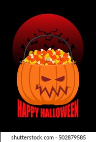 Pumpkin basket for Halloween. Trick or treat. Corn candy for terrible holiday. Horrible vegetable basket of sweets
