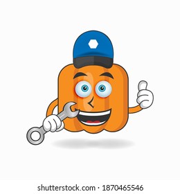 The Pumpkin mascot character becomes a mechanic. vector illustration