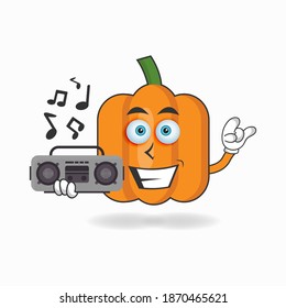 Pumpkin mascot character holding a radio. vector illustration