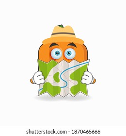 The Pumpkin mascot character holds a map. vector illustration