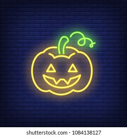 Pumpkin neon sign. Scary carved pumpkin. Night bright advertisement. Vector illustration in neon style for Halloween and all saints eve