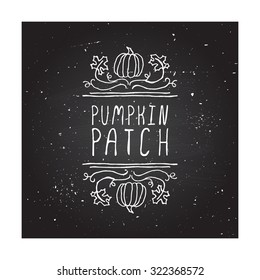 Pumpkin patch. Hand-sketched typographic element with cute little pumpkins on  chalkboard background. 
