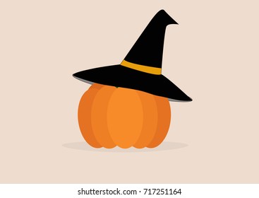 pumpkin in witch hat on a light background.