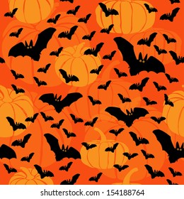 Pumpkins and bats seamless background. Vector pattern for web-design, textile, graphic design. Halloween background 