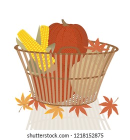 Pumpkins and corn cobs in  wicker basket isolated on white background