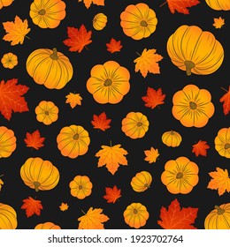 Pumpkins and maple leaves seamless pattern. Autumn. Halloween