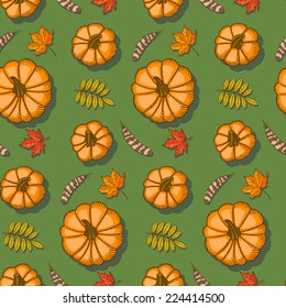 Pumpkins and maple leaves. Vector seamless pattern.