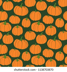 Pumpkins pattern. Autumn seamless vector pattern with hand drawn pumpkins on green background.
