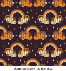 Pumpkins and rainbows boho halloween seamles pattern. Fall groovy flowers 70s retro style vector illustration purple background. 