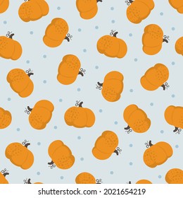 Pumpkins repeat seamless vector pattern on blue background