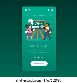 pupils holding pencils standing in front of chalk board with now open text coronavirus quarantine is over concept smartphone screen mobile app full length copy space vector illustration