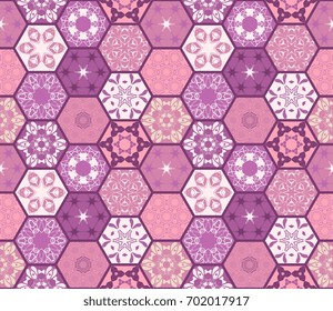 Purple seamless patchwork pattern from different hexagonal patches. Vector illustration.