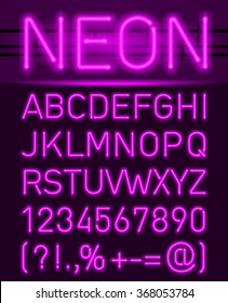 Purple set neon font and symbols isolated on black