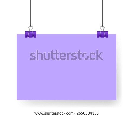 Purple sheet of paper, note hanging on binder clip. A4 format. Album orientation