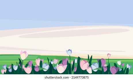 Purple tulips on the meadow. Beautiful nature landscape.