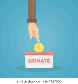 Putting coin in donate box.