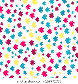 The puzzle background made out of blue, violet and yellow puzzle pieces / The seamless puzzle background / The  jigsaw