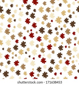 The puzzle background made out of brown puzzle pieces / The seamless puzzle background / The jigsaw