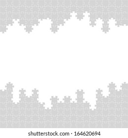 The puzzle border made out of grey puzzle pieces /The puzzle border / The  jigsaw border