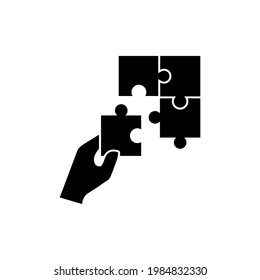 Puzzle icon, Hand holding puzzle logo isolated on white background