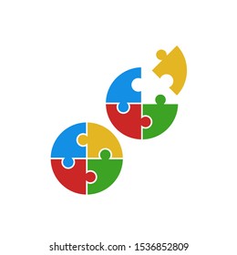 Puzzle icon vector. Circle from colored jigsaw puzzle pieces, complete and incomplete. Vector illustration isolated on white background