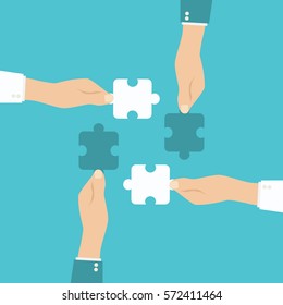 Puzzle piece in human hands. Team work